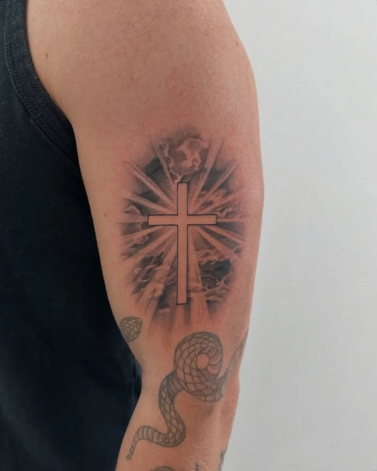 Medium Blackwork Cross with Snake on Men Arm Tattoo by @winterhavenink