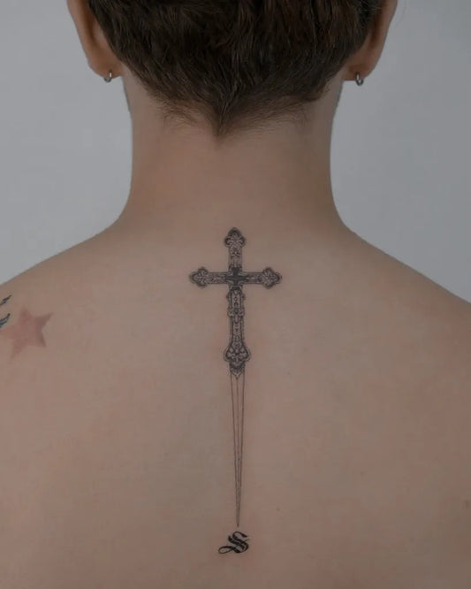 Medium Blackwork Cross with Snake on Women Back Tattoo by @naughty_rabbit_tattoo