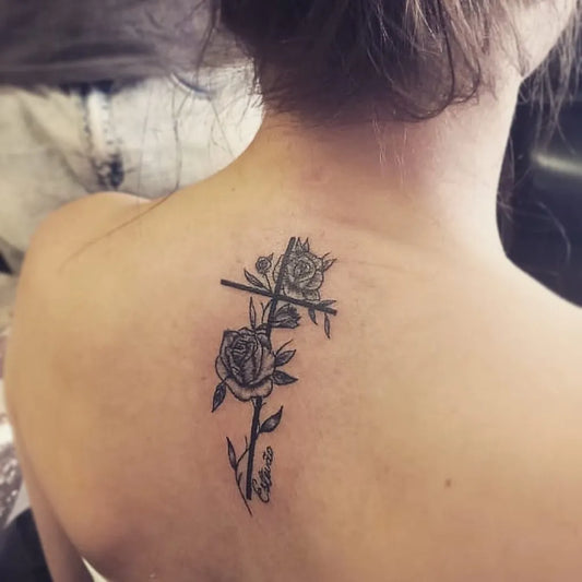Medium Blackwork Crosses and Roses on Women Back Tattoo by @shaheen.maharaj