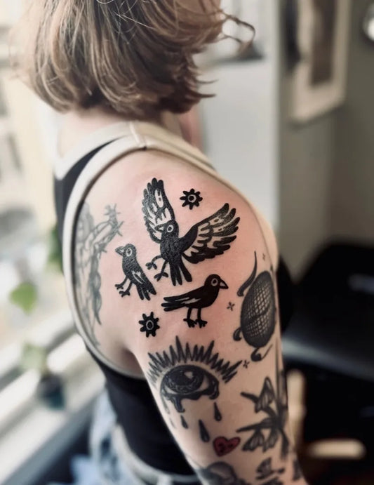 Medium Blackwork Crow Eye Sun Tattoo on Women Arm by @goodgear.tattoo