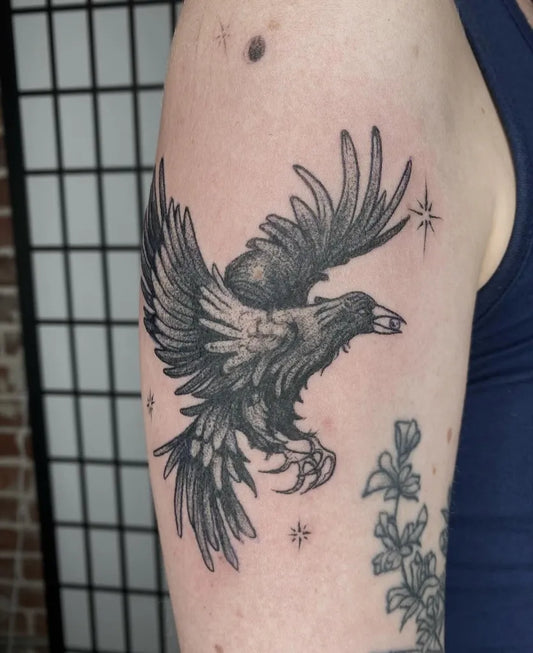 Medium Blackwork Crow with Flowers Tattoo on Men Arm by @magic_rabbitt