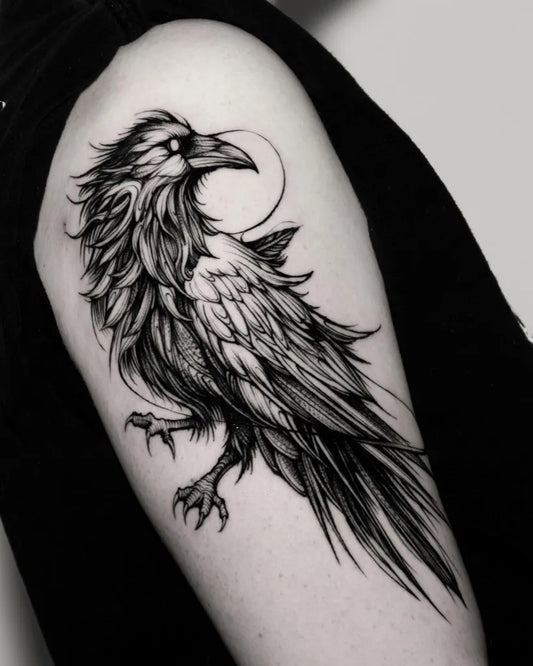 Medium Blackwork Crow with Moon Tattoo on Women Shoulder by @marni_tattoo
