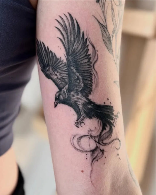Medium Blackwork Crow with Smoke Women Arm by @coraleknowles