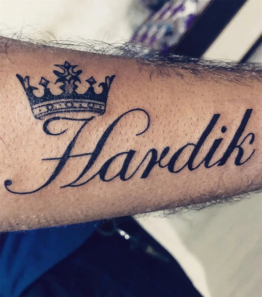Medium Blackwork Crown and Name Tattoo on Men Arm by @jtog_tattoos