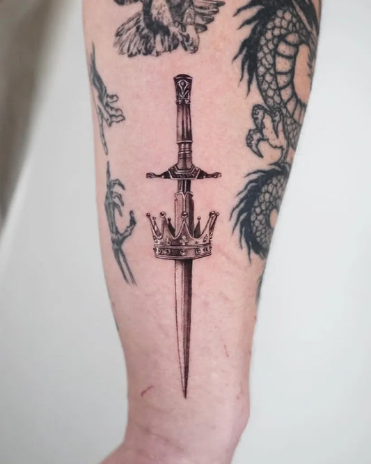 Medium Blackwork Crowned Sword on Men Arm Tattoo by @saintmichaeltattoo