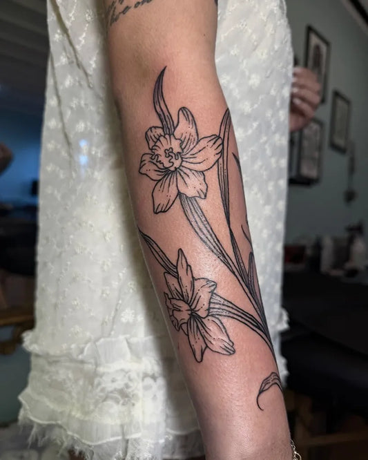 Medium Blackwork Daffodil Flowers Tattoo on Women Arm by @poison.well