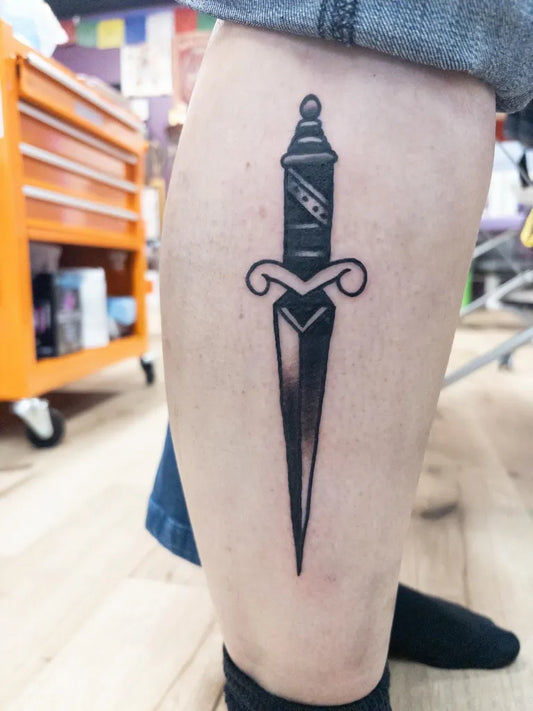 Medium Blackwork Dagger Tattoo on Men Leg by @joshmartin_wv