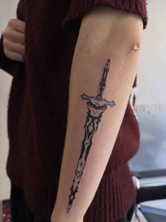 Medium Blackwork Dagger Tattoo on Women Arm by @aethere.ttt