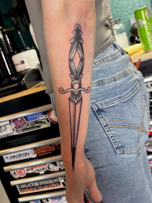 Medium Blackwork Dagger Tattoo on Women Arm by @sissy.terpstra