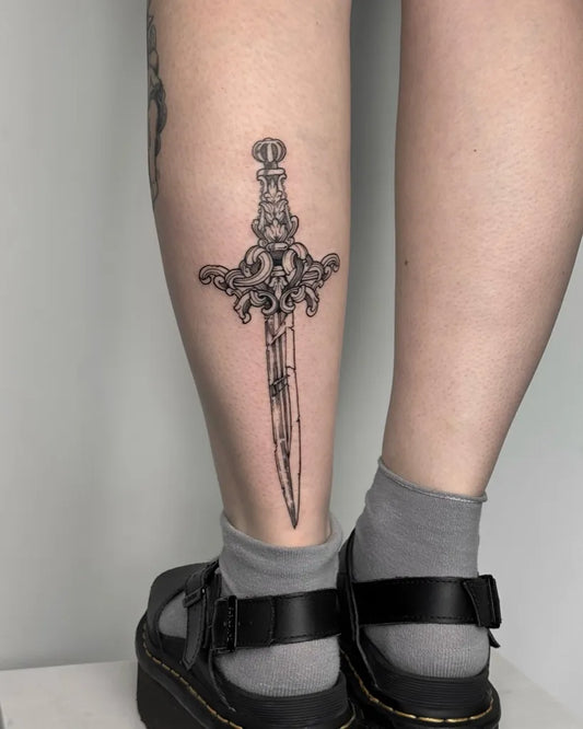 Medium Blackwork Dagger Tattoo on Women Thigh by @bonddear