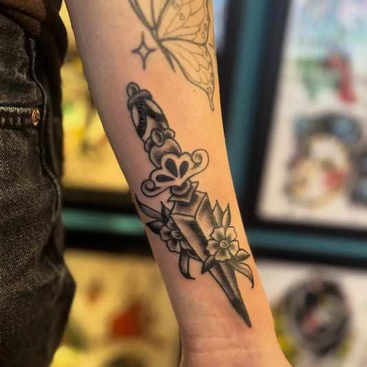 Medium Blackwork Dagger and Flowers Tattoo on Women Arm by @luckyleena999