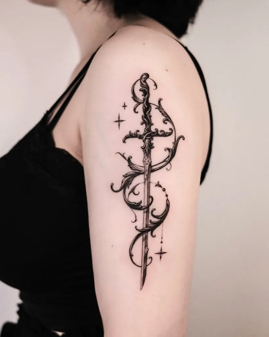 Medium Blackwork Dagger and Vines Tattoo on Women Shoulder by @auua.tattoo