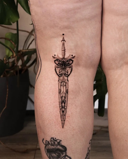 Medium Blackwork Dagger with Moth Tattoo on Women Thigh by @suzies_ink