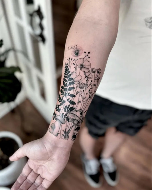 Medium Blackwork Dandelion Ferns Mushrooms Tattoo on Men Arm by @tessameliaa