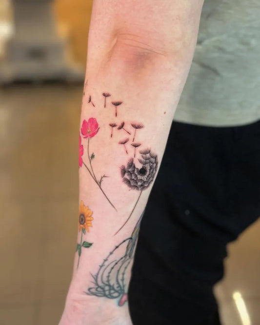 Medium Blackwork Dandelion Poppies Tattoo on Women Arm by @tattoo_by_awelgalvez