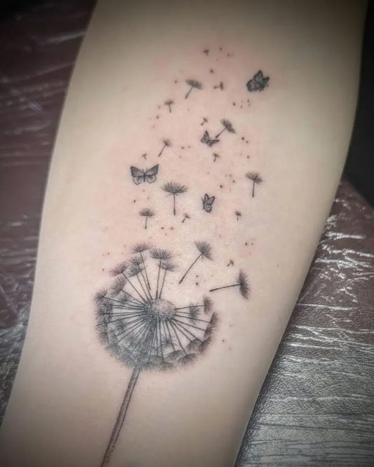 Medium Blackwork Dandelion and Butterflies Tattoo on Women Arm by @tbt_is_love_tattoo