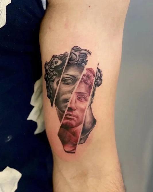 Medium Blackwork David Bust Tattoo on Men Bicep by @hawktattoodehradun