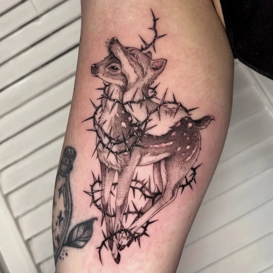 Medium Blackwork Deer with Barbed Wire Tattoo on Women Arm by @ka.ma.gi