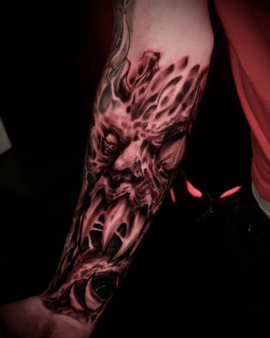 Medium Blackwork Demon Face Tattoo on Men Arm by @charliekarnage