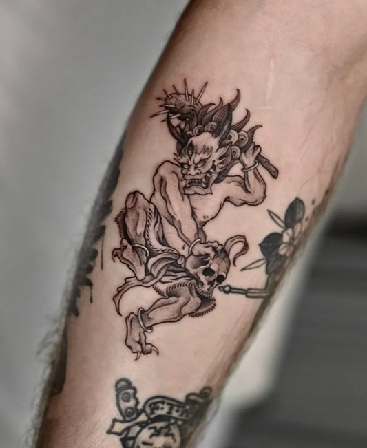 Medium Blackwork Demon Skull Tattoo on Men Arm by @ts.kanatattoo