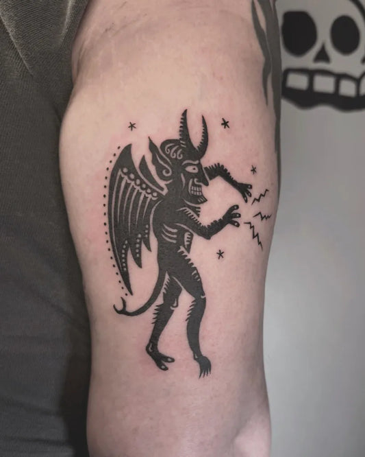Medium Blackwork Demon with Stars Tattoo on Men Arm by @whiteghoststudio