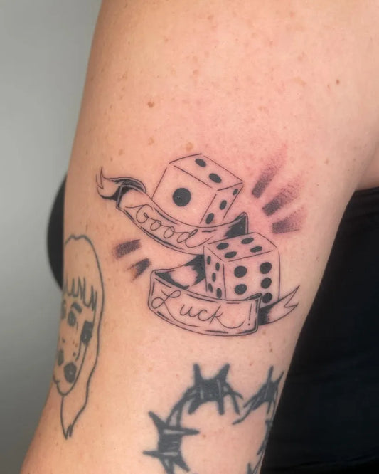 Medium Blackwork Dice Banner Tattoo on Women Arm by @carlyjordyn