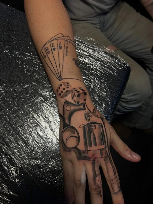 Medium Blackwork Dice Gun Tattoo on Men Wrist by @amazingmiaa