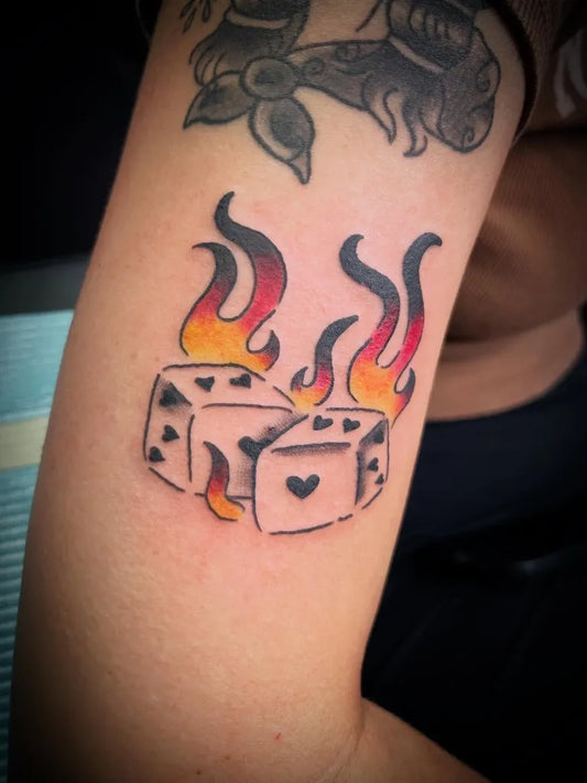 Medium Blackwork Dice and Flames Tattoo on Women Arm by @inkedbybrandy