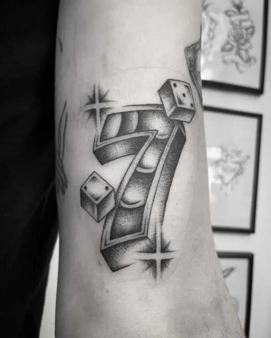 Medium Blackwork Dice and Seven Tattoo on Men Arm by @sonnyrohantattoo