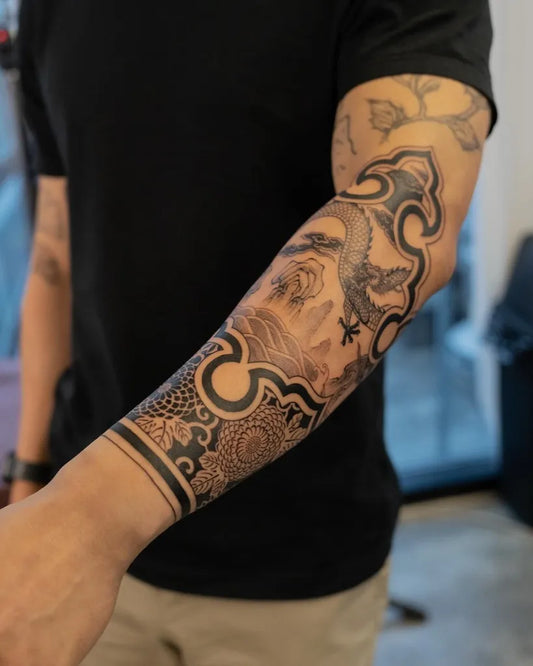Medium Blackwork Dragon Cloud Pattern Tattoo on Men Arm by @saki.lss