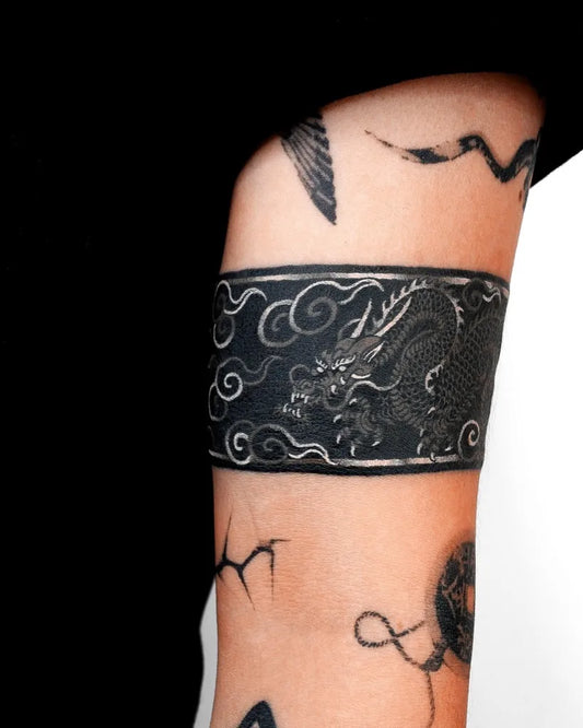 Medium Blackwork Dragon Cloud Tattoo on Women Arm by @nobodytattoo