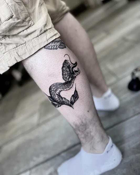 Medium Blackwork Dragon Tattoo on Men Calf by @erinwoodstattoos