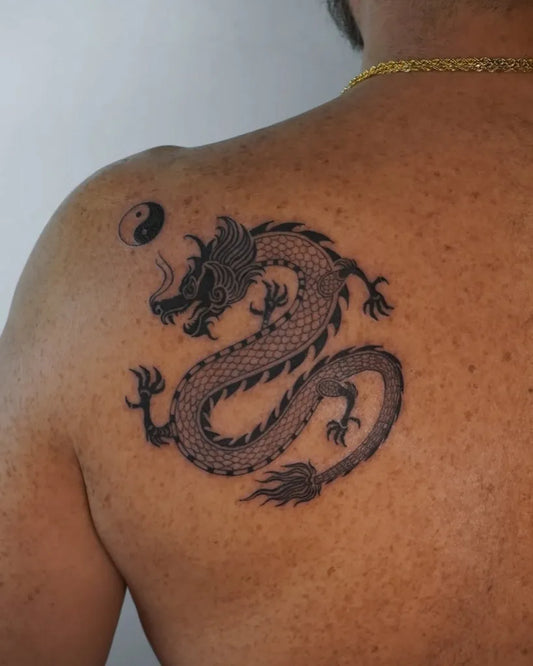 Medium Blackwork Dragon Yin Yang Tattoo on Men Shoulder by @legalpics