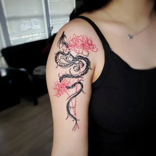 Medium Blackwork Dragon and Red Spider Lily Tattoo on Women Shoulder by @osorio.ink