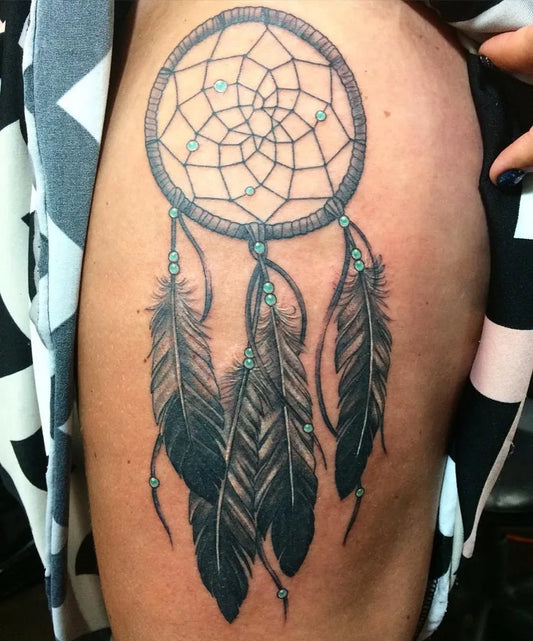 Medium Blackwork Dream Catcher with Feathers Tattoo on Women Hip by @ashleynicoletattoos