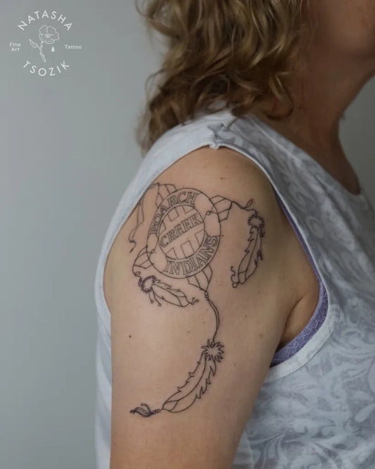 Medium Blackwork Dream Catcher with Feathers Tattoo on Women Shoulder by @natasha_tsozik