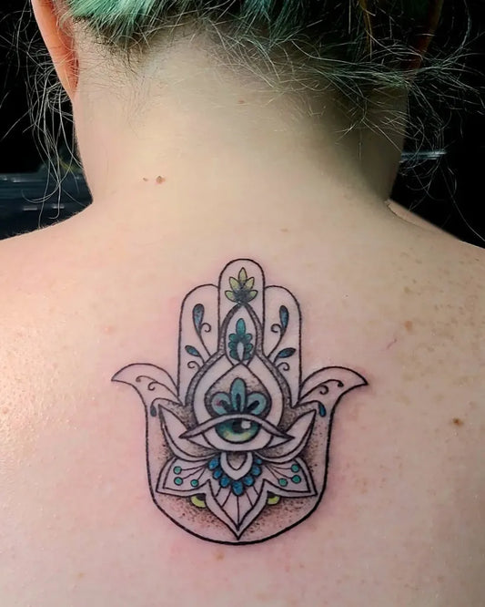 Medium Blackwork Evil Eye Hamsa on Women Back Tattoo by @rach.nyx_tattoos