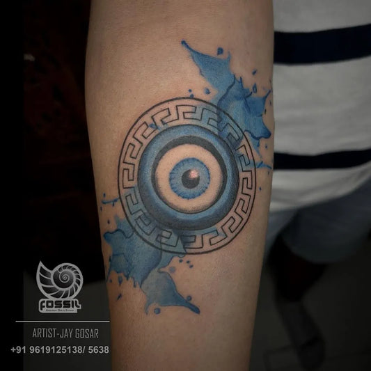 Medium Blackwork Evil Eye on Men Arm Tattoo by @fossil_tattoo_and_art_studio