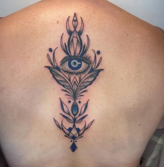 Medium Blackwork Evil Eye with Floral Mandala on Women Back Tattoo by @vince_tattoos_