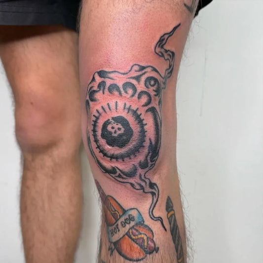 Medium Blackwork Eye and Hotdog Men Knee Tattoo on by @ashley_thorne_tattoo