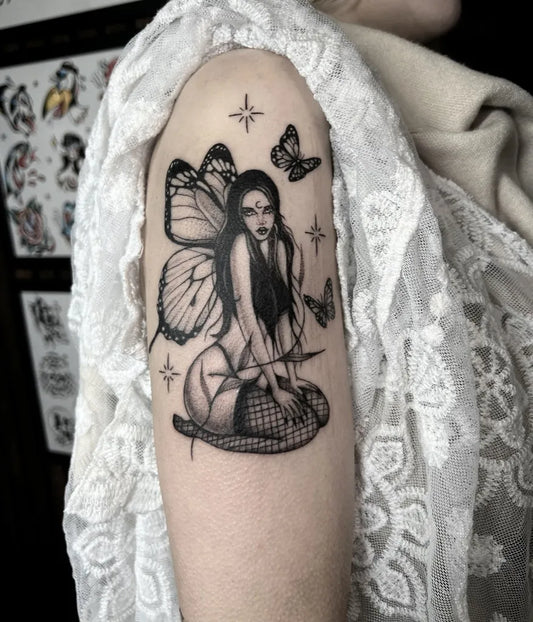 Medium Blackwork Fairy with Butterflies on Women Arm Tattoo by @ericastatts