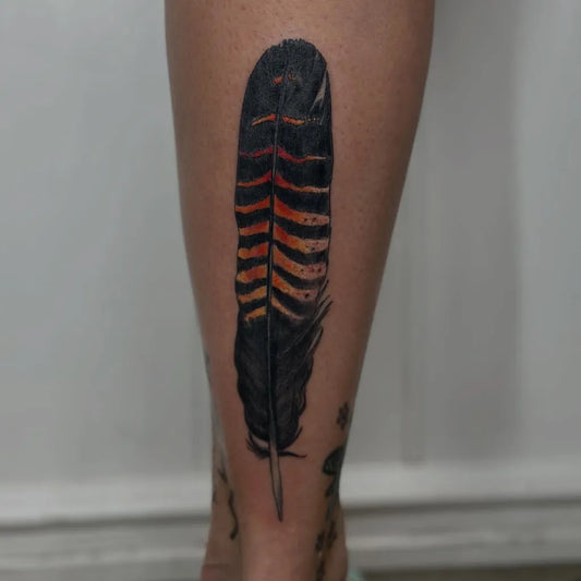 Medium Blackwork Feather Tattoo on Women Thigh by @ink_by_taneika