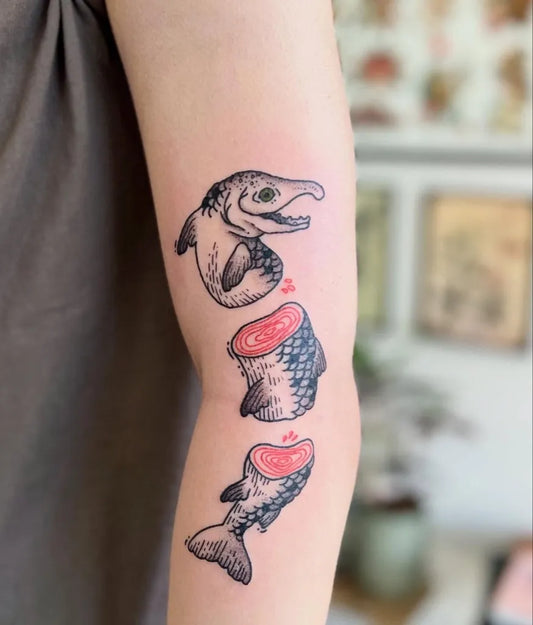 Medium Blackwork Fish Slices Tattoo on Women Arm by @taurusteej.tattoos