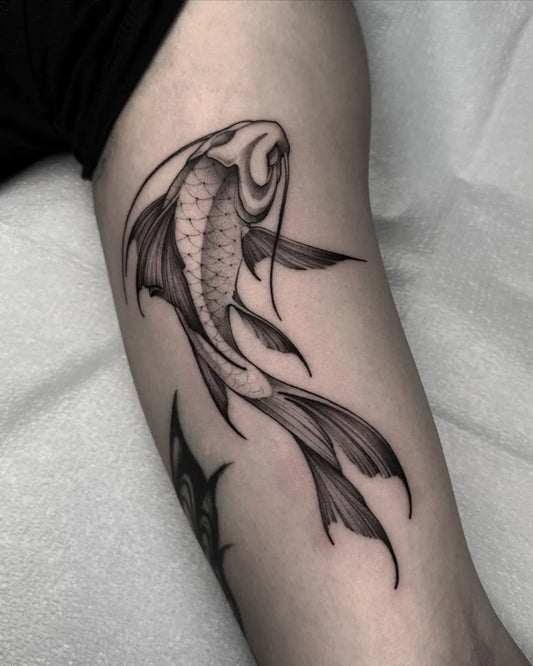 Medium Blackwork Fish Tattoo on Men Arm by @barbara.tattooer