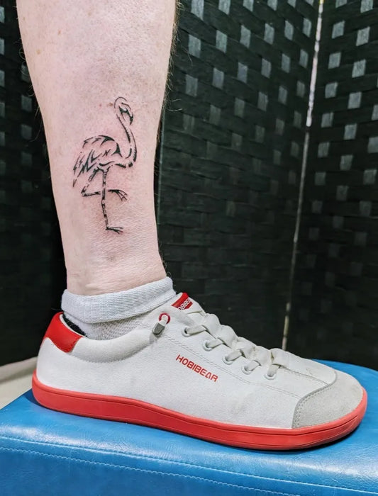 Medium Blackwork Flamingo Tattoo on Men Leg by @koiadrayton