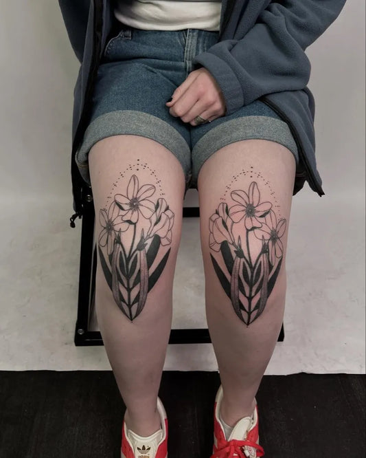 Medium Blackwork Floral Bouquet Tattoo on Women Knee by @alli.shelly