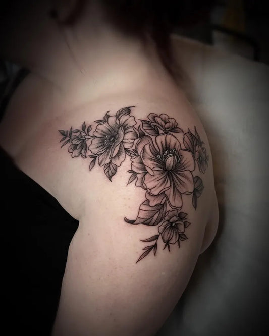 Medium Blackwork Floral Bouquet Tattoo on Women Shoulder by @nicole_tattoos11