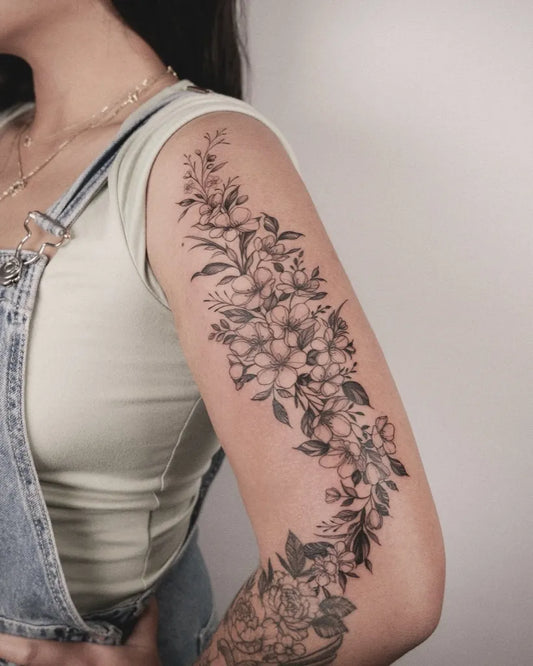 Medium Blackwork Floral Bouquet Tattoo on Women Upper Arm by @wong_tattooer