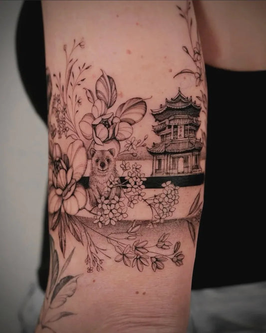 Medium Blackwork Floral Pagoda Tattoo on Women Upper Arm by @thefoxdenamsterdam