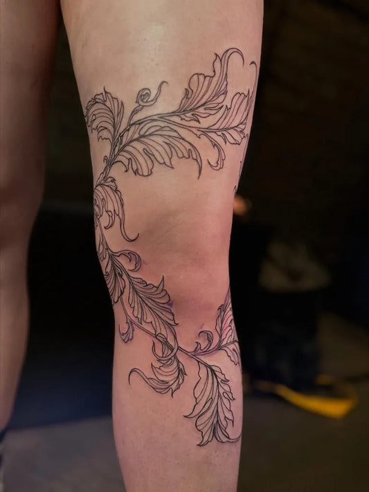 Medium Blackwork Floral Vine Tattoo on Women Knee by @ninareymondtattoo